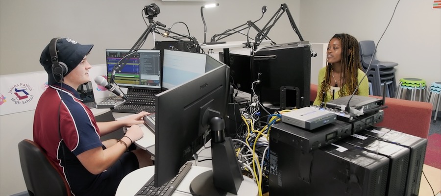 two students in a radio studio